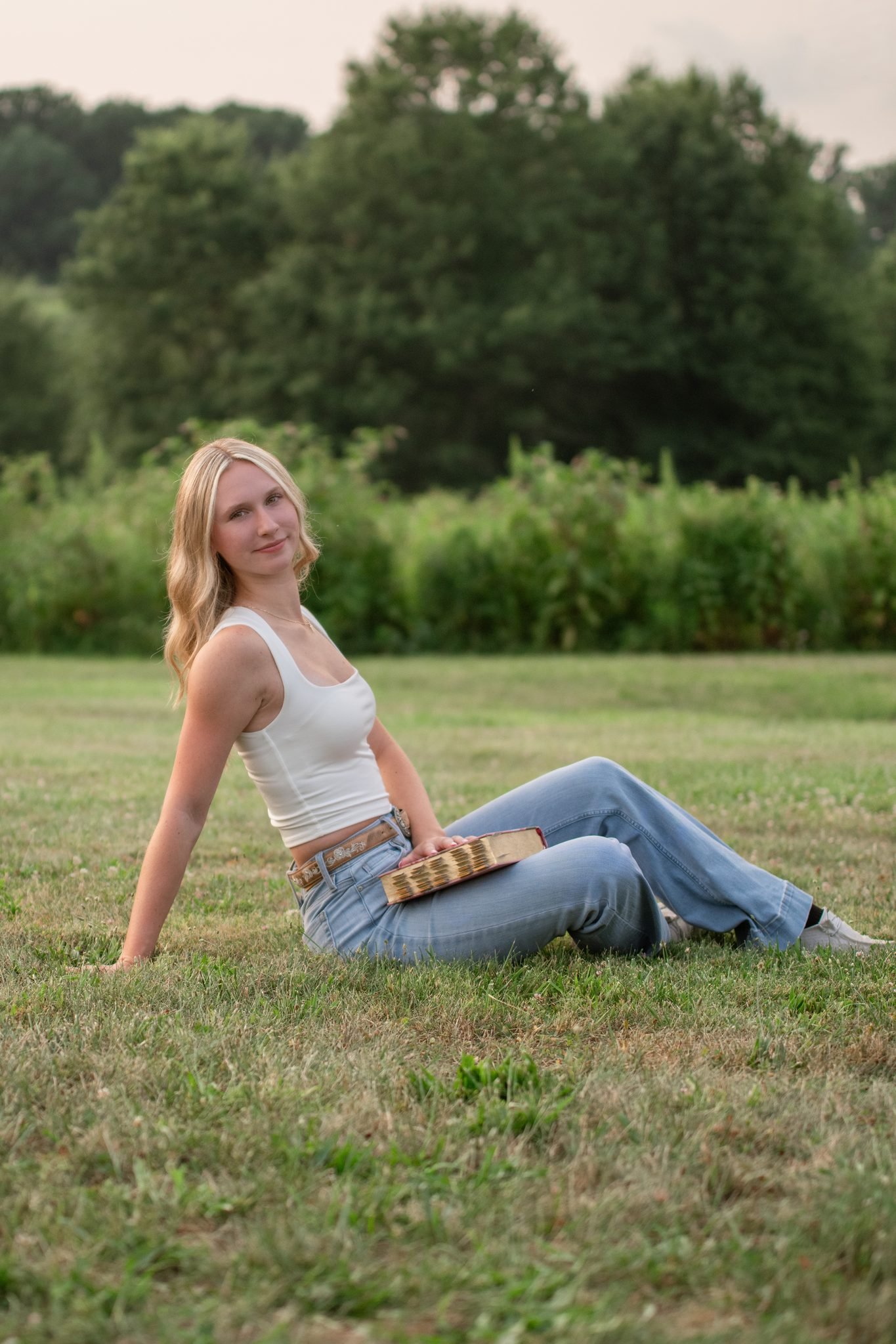 Ephrata senior holding her softball glove during senior portraits at Middle Creek Wildlife Management Area